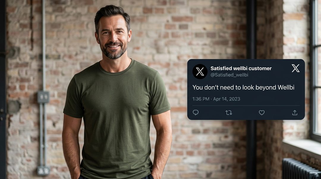 Man wearing a Wellbi olive bamboo t-shirt in a brick-walled loft alongside a customer tweet saying you don't need to look beyond Wellbi — the last everyday t-shirt you'll need to shop for