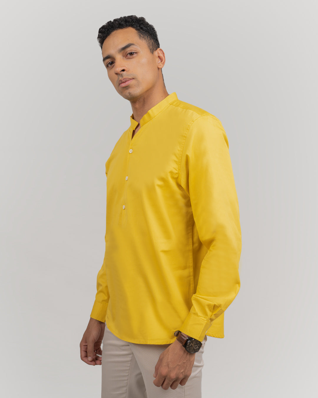 Comfortable traditional yellow short kurta for men, ideal for casual and festive wear.